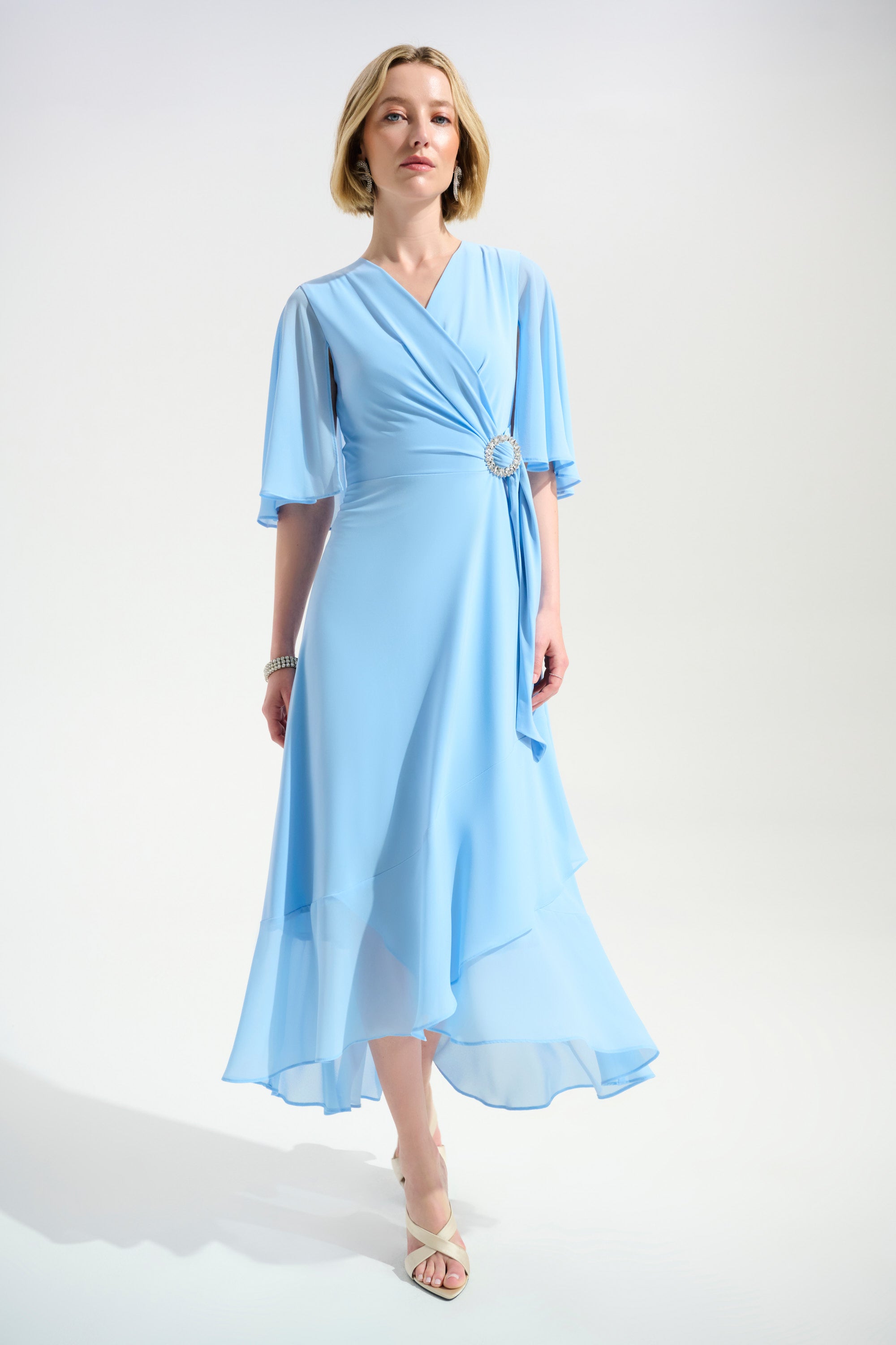 Joseph Ribkoff Flowy Wrap Dress With Buckle Rhinestones Detail Style 261714 Sky Blue / 22 Joseph Ribkoff Flowy Wrap Dress With Buckle Rhinestones Detail Style 261714 Sky Blue / 22