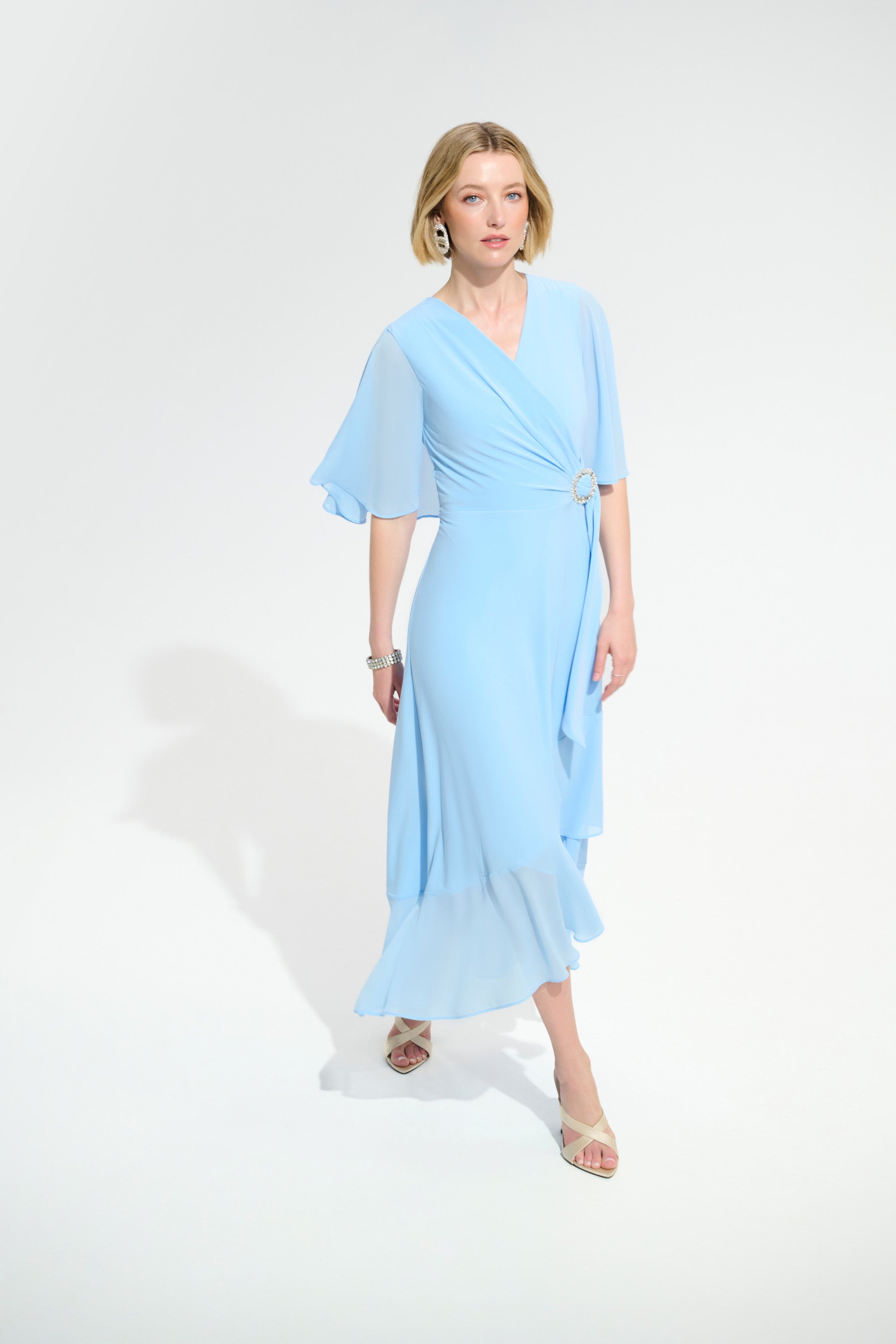 Joseph Ribkoff Flowy Wrap Dress With Buckle Rhinestones Detail Style 261714 Sky Blue / 22 Joseph Ribkoff Flowy Wrap Dress With Buckle Rhinestones Detail Style 261714 Sky Blue / 22